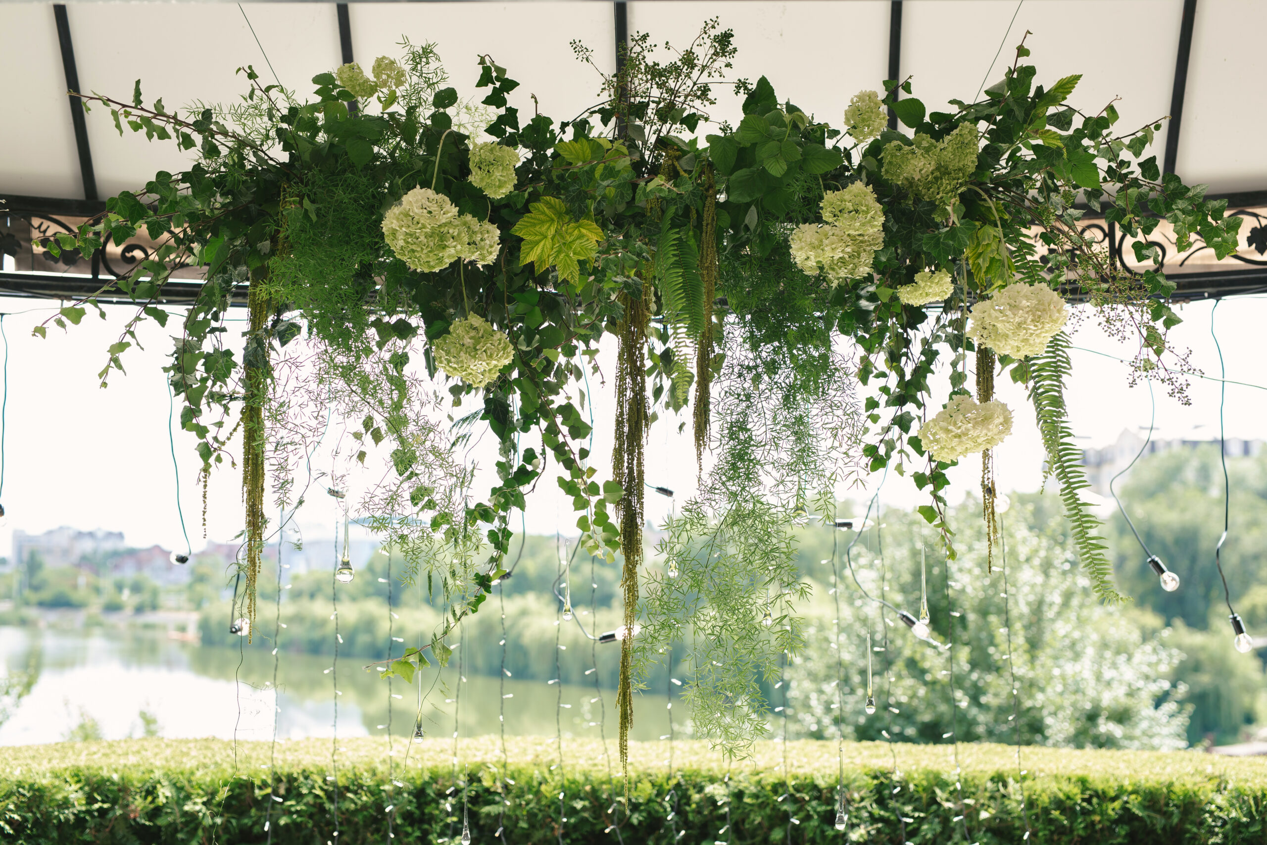 Details. Wedding ceremony in the open air of fresh flowers, with candles. Gentle and beautiful wedding decor for newlyweds.