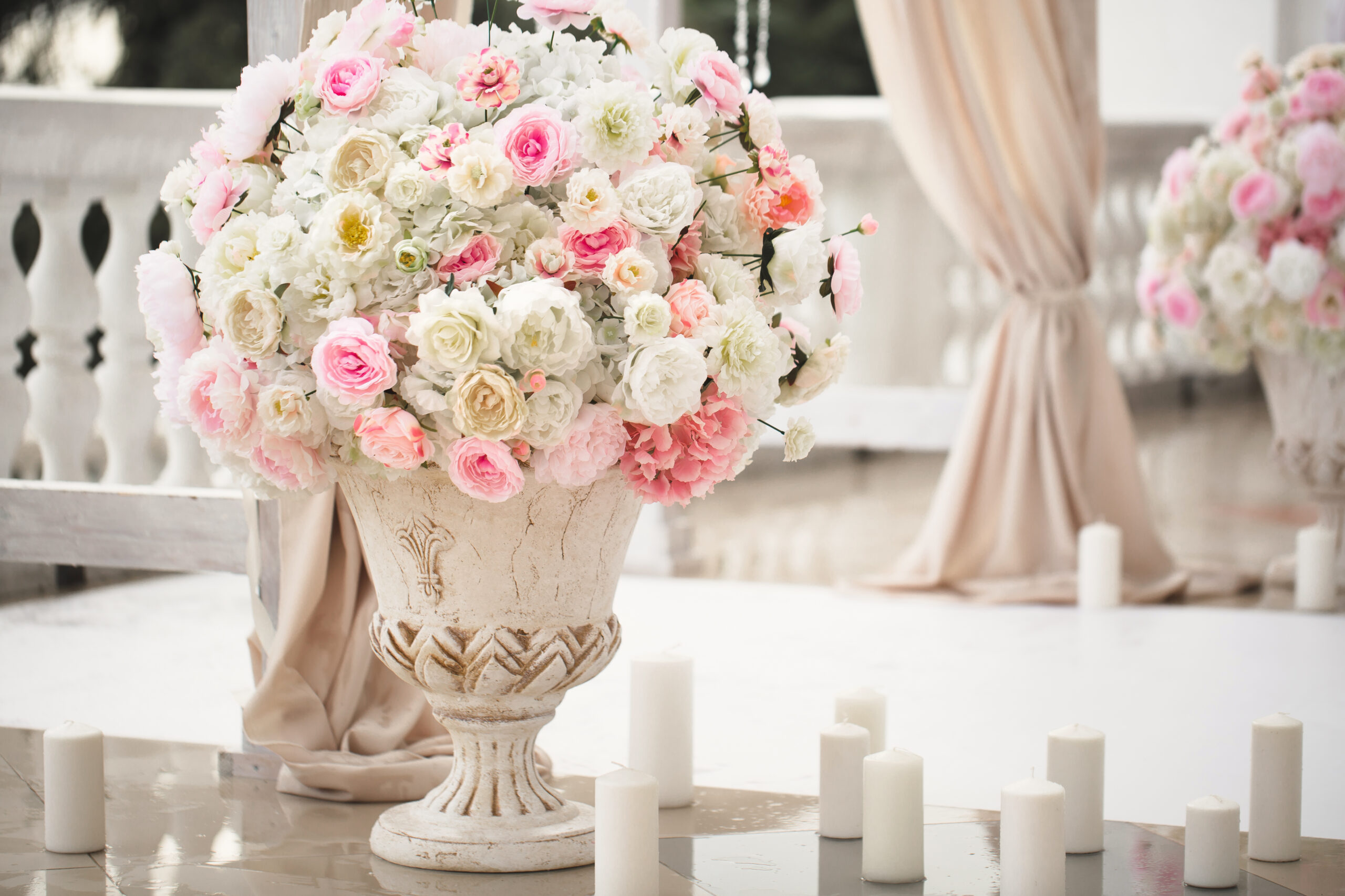 Details. Wedding ceremony in the open air of fresh flowers, with candles. Gentle and beautiful wedding decor for newlyweds.